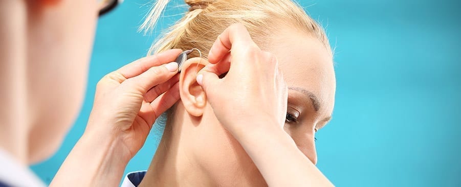 Woman being fitted for hearing aid
